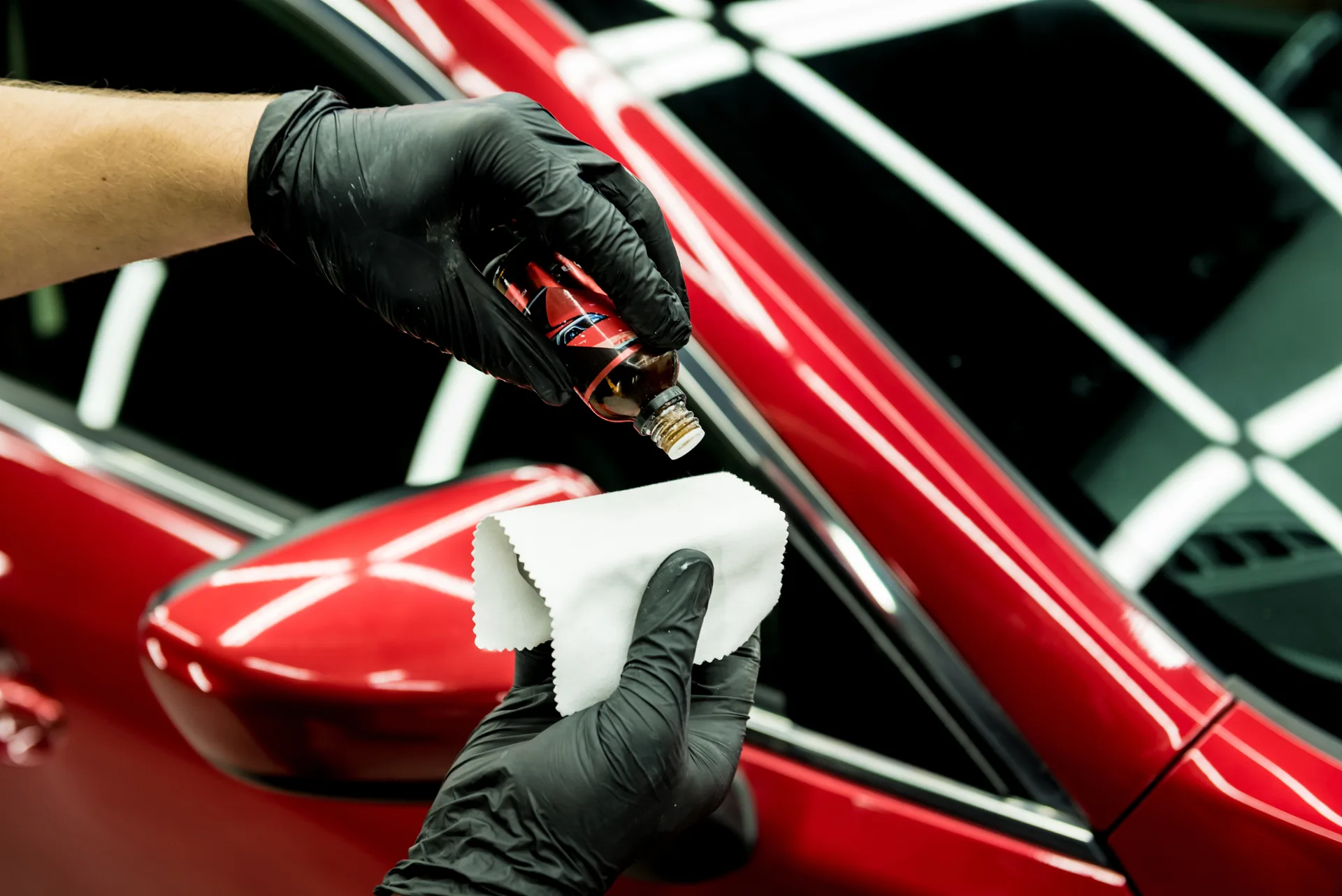 Professional detailing worker restoring vehicle finish at R Car Wash Grand Prairie TX
